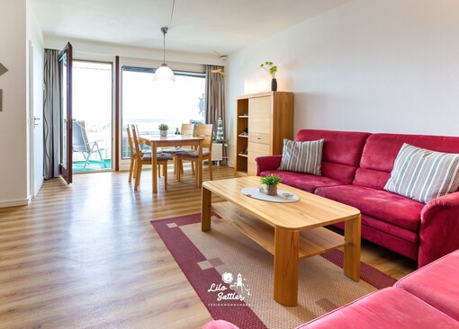 Wohnzimmer mit Sofa-Appartement im Hochhaus - Ferienhaus / Ferienwohnung Büsum - 1